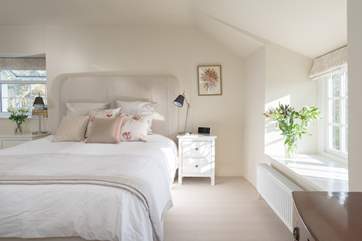 The master bedroom is light, beautifully decorated and presented and has plenty of storage space.