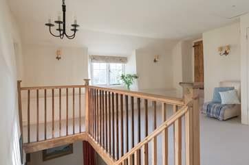 The stairs rise up from the music-room - the door to the right of the photo is Bedroom 4.