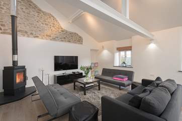 This detached barn conversion offers additional contemporary living space, complete with super-size TV screen, table-tennis and table-football.