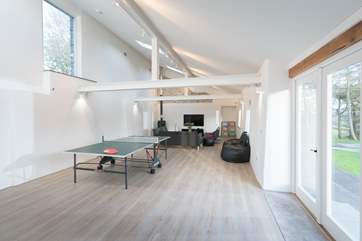The barn conversion is set up as a games room.