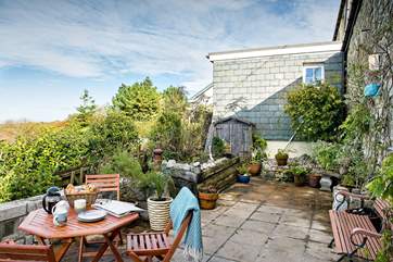 The enclosed terrace is the perfect spot for morning coffee or a glass of wine at the end of the day.