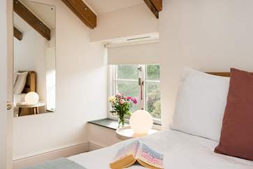 The contemporary design complements the character of the deep window sills and exposed beams.