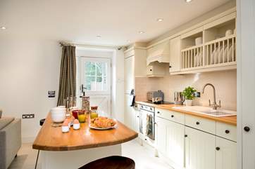 The stylish kitchen is well-equipped.