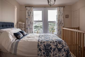 The bedroom shares the views across the valley to Heligan.