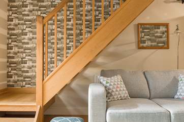Open-tread steps (take care) allow light into the living-room.