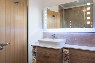 The LED lights in the bathroom mirror change colour.