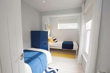 The lovely twin bedroom is perfect for children or adults alike.