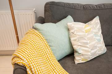 In the colder months, curl up on the sofa with a blanket.