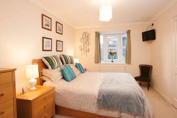 The master suite, where you can snuggle up and watch a film before bedtime