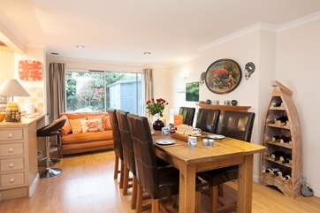 The lovely large dining table is a great place to enjoy your holiday mealtimes