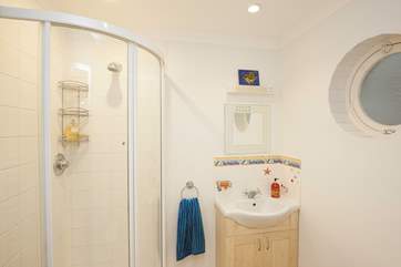 The downstairs shower-room is perfect to wash off the sand from inbetween your toes after a day on the beach