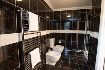 One of the three bathrooms, with a separate shower cubicle.