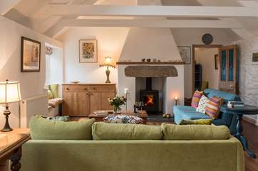 Sitting room with comfy sofas. A good selection of books to read and games to play are available for your pleasure.