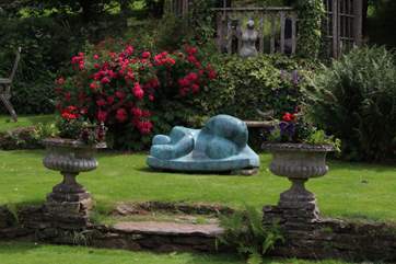 You are surrounded by beautifully maintained gardens and landscapes.
