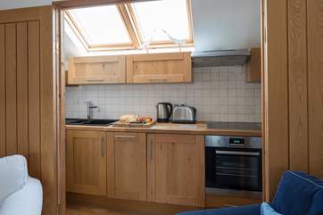 The kitchen is compact and well-equipped.