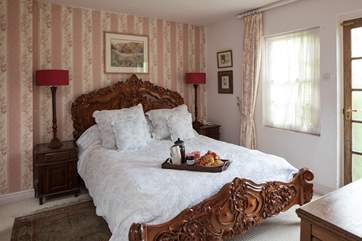 The master bedroom comprises of this rather grand, king-size bed.