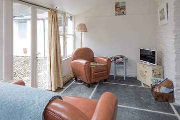 The sweet sitting-area has toasty under-floor heating, making it the ideal place to snuggle up after a day out and about.