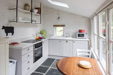 The kitchen is beautifully-designed with creative touches added by the owner, such as the shelving - a nod to The Apple Store's past.
