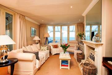 The stunning main sitting-room, doors take you out onto the balcony with views over the Solent, take a deep breath of that wonderful sea air.