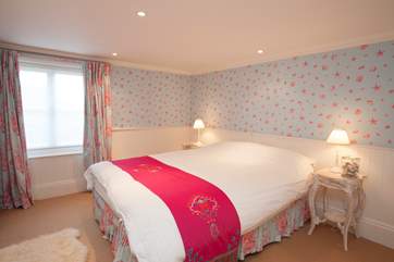 This beautifully decorated double bedroom is on the lower ground floor and has a king-size bed.