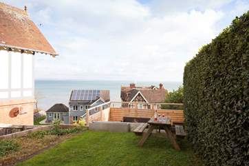 Doors open out from the lower ground floor and take you onto the lawned area and futher steps down to the decking.