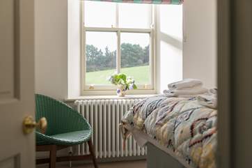 Bedroom 3 looks out over the little meadow that adjoins the parking area.