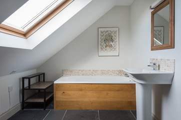 The en suite has both a bath and shower cubicle.