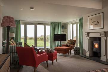 The big main sitting-area looks out to the garden and panoramic views.