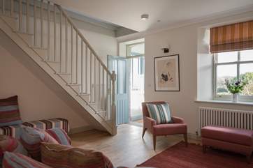 You enter into an open plan sitting/kitchen/dining area.