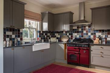This is a custom-made, hand-built kitchen complete with range cooker.