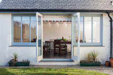 Doors open from the dining-area to the garden.