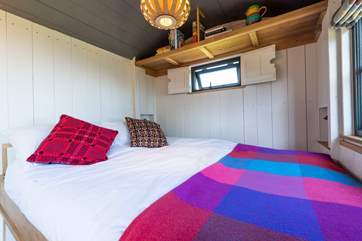 The cleverly-designed table and benches convert with ease into the comfy double bed.