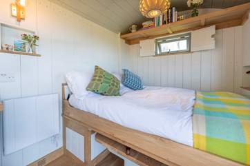 The comfy double bed converts with ease from the dining table and benches.