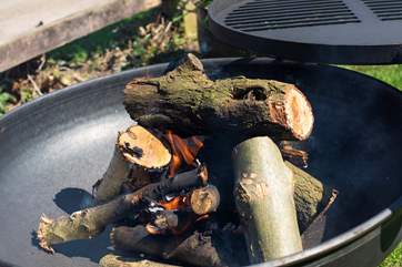 Cook up something scrummy on the fire-pit BBQ.
