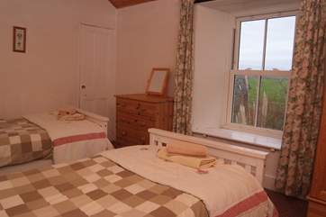 The first floor twin bedroom has lovely sea views.