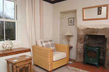 The sitting-room is heated by an electric stove.