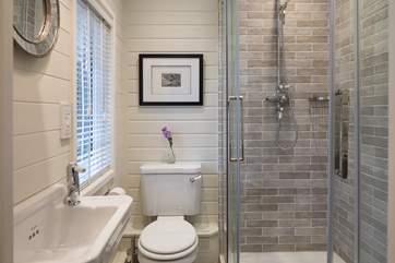 The en suite shower-room has a drench head and cosy heated towel rail.
