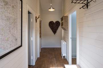 From the front door, the kitchen is to the right and bedroom 2 to the left.