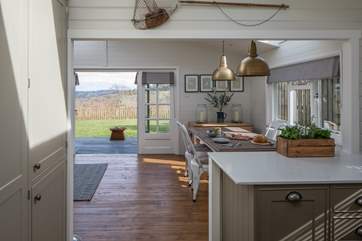 French doors lead out to the verandah and garden beyond. The fire pit has been removed.
