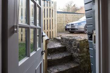 There are four steep steps from the parking area down into Lynchet Lodge.