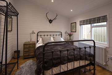 The master bedroom, bedroom 1, with comfy 5ft bed, gorgeous linens and and en suite shower-room.
