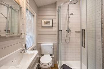 The en suite shower-room has a drench head and heated towel rail.