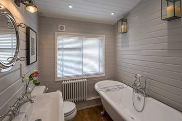 The family bathroom is stylish and cosy.