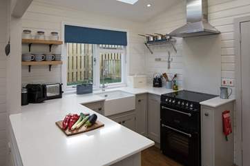 The bespoke fitted kitchen is very well-equipped to meet all your holiday needs, including a Nespresso machine.