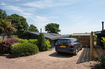 The parking area is beside the lodge, further cars can be parked on the quiet lane.