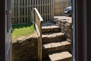 There are four steep steps from the parking area down into Lynchet Lodge.