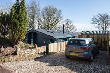 The view when you arrive, with private parking, 4 steep steps lead down to the lodge.