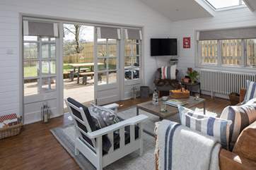 Stylishly decorated with French doors leading onto the decking and enclosed garden.