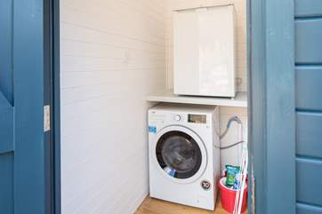 The washing machine/drier and the freezer are in a cupboard in the courtyard.