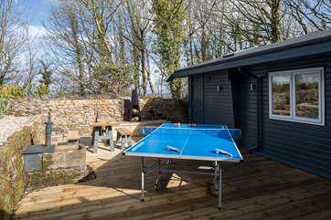 The rear courtyard is a sheltered sun-trap, ideal for a little competition on holiday.